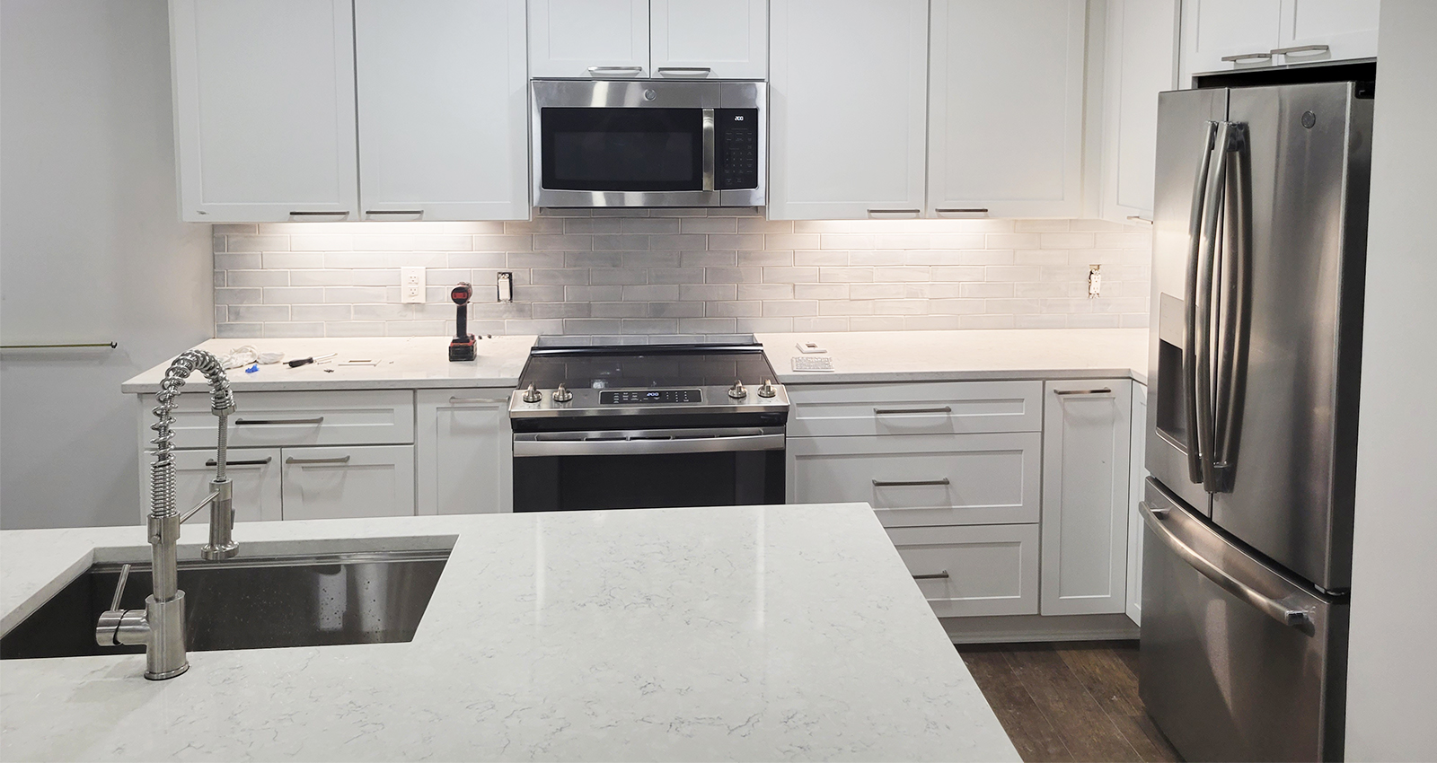 Greenwood, Indiana Kitchen remodel - white kitchen cabinets with white quartz countertops and stainless steel appliances
