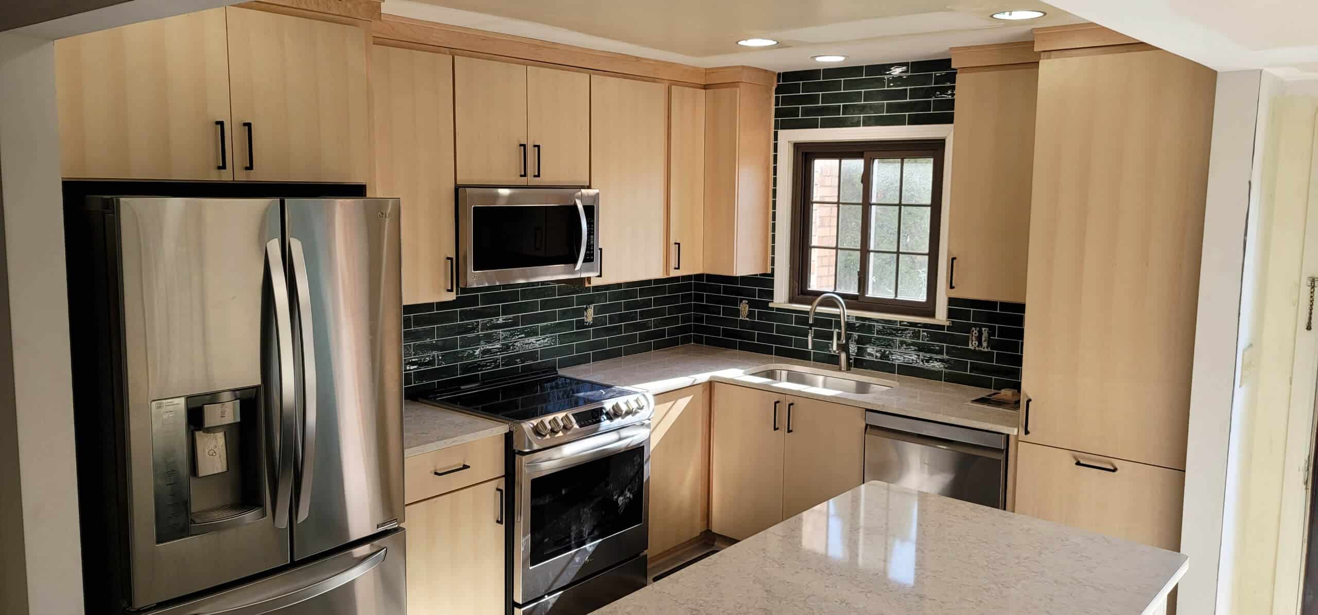Indianapolis Home Remodeling Contractors - remodeled kitchen with black tile in Carmel, Indiana