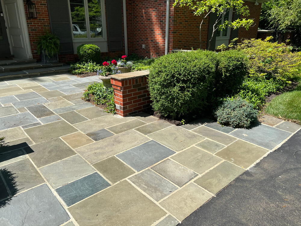 outdoor pavers and brick wall