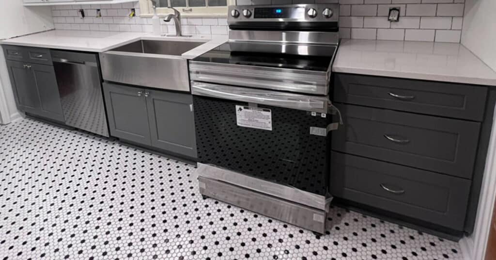 best kitchen flooring - black and white kitchen with gray cabinets and black and white tile flooring